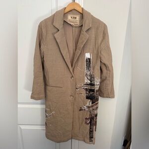 Women's Tan Coat with Artistic Design